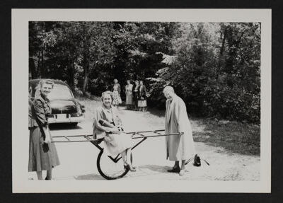 National Council Members Playing with Cart at Council Meeting Photograph, June 1950