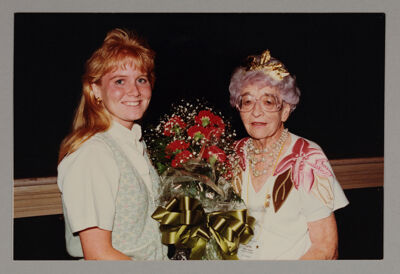 Ruth Winsor Receiving Carnations from Phi Chapter President Photograph, c. 1990