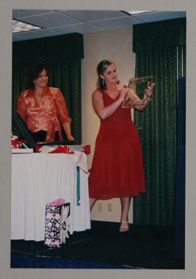 Marsha Grady and Deb Stephens Opening Gifts at Iota Omega Chapter Installation Photograph, April 23, 2005