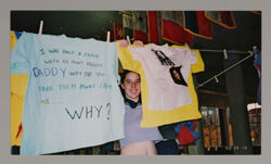 Alpha Chi Omega Member Hanging Domestic Violence Awareness Shirts Photograph, April 19, 2002