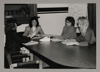 Second Century Campaign Committee Members Finalizing Shoe Marketing Campaign Photograph, c. 1985