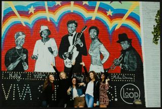 Five Missouri Alpha Chapter Members in Front of Mural Photograph