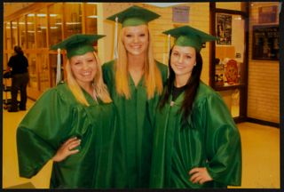 Three Missouri Alpha Chapter Members in Graduation Robes Photograph
