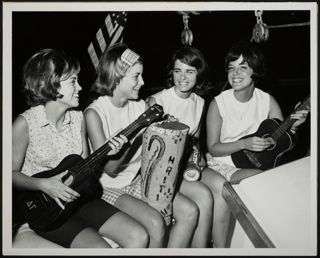 Four Gamma Theta Chapter Members Playing Instruments Photograph