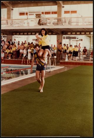 Mr. Anchor Splash® Carrying a Gamma Alpha Chapter Member Photograph