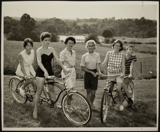 Sara Schmitt and Nancy Haenel Riding Bicycles With Children Photograph, 1962