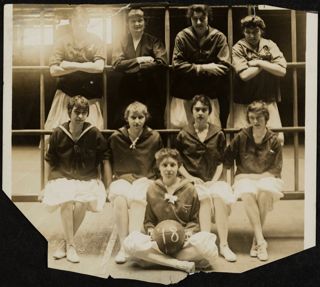 Helen Price and Margaret Johnson With Basketball Team Photograph, 1918