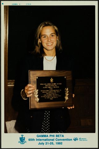 Alpha Omega Chapter Member Holding Pollack Scholarship Award Plaque Photograph, July 21-25, 1992