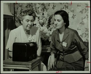 Mrs. George Simonson and Mrs. Ralph Dippell Listening to Radio Photograph, 1952