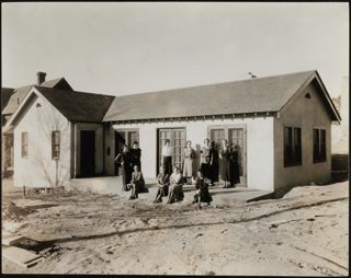Sisters Outside Alpha Phi Chapter House Photograph 1