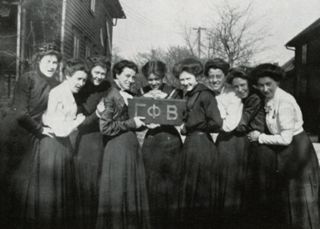 Kappa Chapter Members in Front of House Photograph