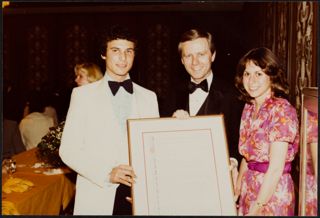 Unidentified Members Receiving Framed Award Photograph