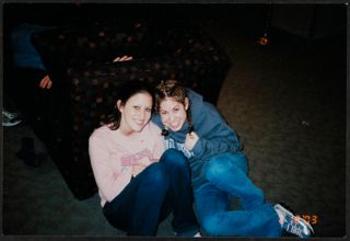 Michelle Weinberg and Vanessa Lustig Sitting Together on the Floor Photograph, February 2003