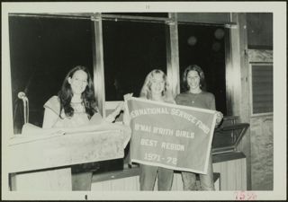 Three BBGs Holding Sign for International Service Fund Photograph, 1972