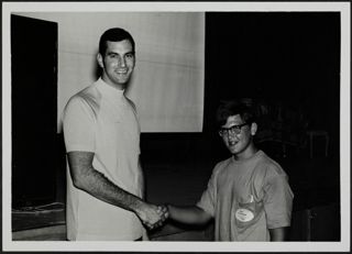 Cory Stoneman and Unidentified Shaking Hands Photograph