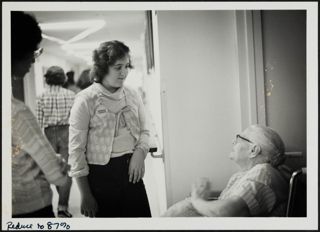Roberta Marks Visiting Patient in Wheelchair Photograph, 1979