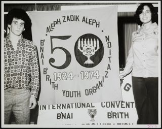BBYO Members Standing With Sign at International Convention Photograph, 1974