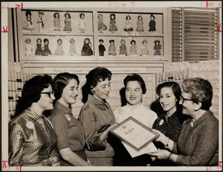 BBYO Members Looking at a Certificate Photograph, February 4, 1958