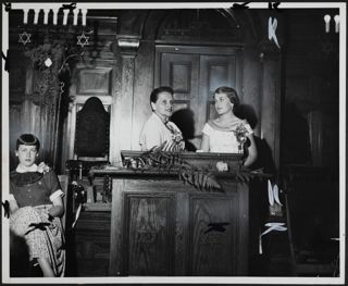 Micki Kana and Unidentified at Podium Photograph