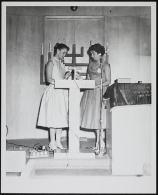 Anne Spiwack and Elaine Gilner During Candle Lighting Photograph, c. 1957