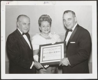 Louis Perlman and Anita Perlman Receiving Award Photograph, January 1966