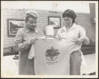 Anita Perlman and Julie Raskin Holding T-Shirt Photograph 1, February 12, 1981