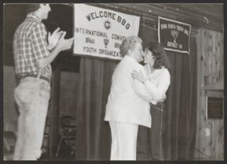 Anita Perlman Receiving Hug at International Convention Photograph, 1984