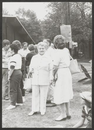 Anita Perlman in Pantsuit Standing Outside Photograph 1