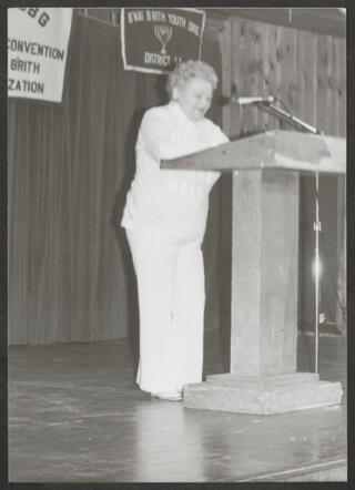 Anita Perlman Speaking at International Convention Photograph