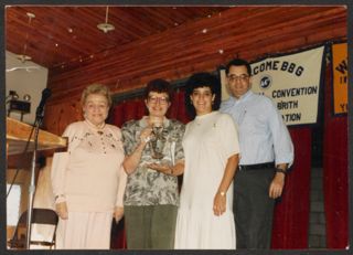 Anita Perlman Standing With Three Others With Trophy at Convention Photograph, 1988