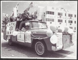 Topai BBG Members Riding on Truck in Parade Photograph 2