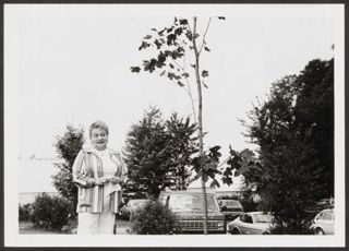 Anita Perlman Standing Outside Next to Tree Photograph 6, August 16-22, 1979