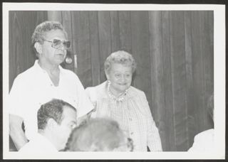 Anita Perlman and Unidentified Man at Executive Committee Meeting of Youth Commission Photograph, 1986
