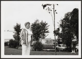 Anita Perlman Standing Outside Next to Tree Photograph 5, August 16-22, 1979
