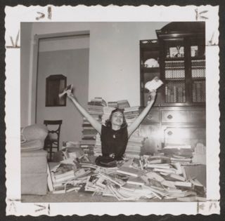 Sue Stark Sitting Amid Books Photograph