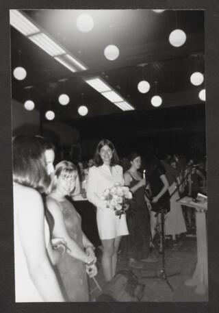 Rachel Berger Holding Flowers at States Photograph, 1999