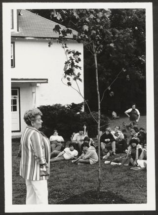 Anita Perlman Speaking to Group Outside Photograph 1, August 16-22, 1979