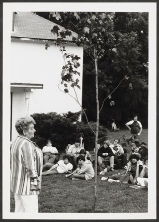 Anita Perlman Speaking to Group Outside Photograph 2, August 16-22, 1979