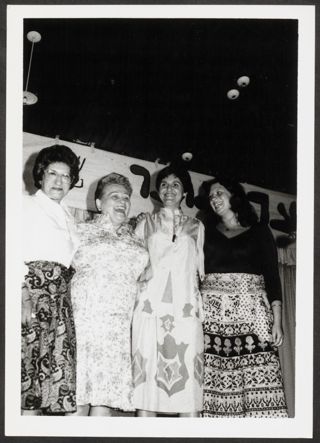 Anita Perlman Embracing Three Others on Stage Photograph 1, August 16-22, 1979