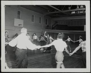 B'nai B'rith Girls Folk Dancing in a Large Circle Photograph 1, 1948