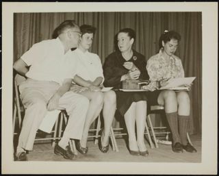 Speakers Sitting on Stage Photograph, 1959