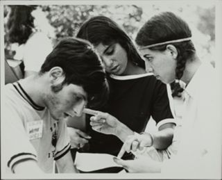 Three BBYO Members Reviewing Document Photograph