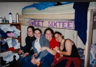 Busell, Bertenthal, Kaster, and Davidson Sitting on Bed Photograph