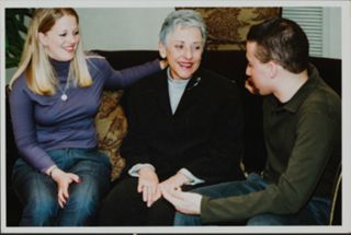 Lynn Schusterman Speaking With Two Members Photograph