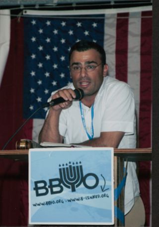 Member Speaking at Podium at Leadership Camp Photograph, July 12, 2006