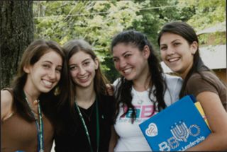 Four Members Sharing a Smile at Leadership Camp Photograph, July 12, 2006