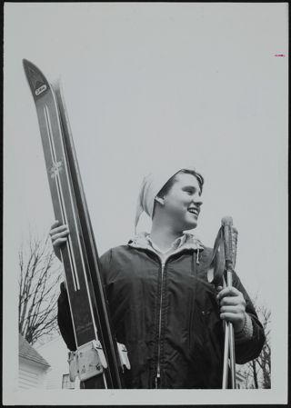 Nancy Clough Holding Skis Photograph, 1967