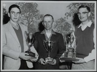 Kollarek, Severod, and Olson Holding Awards Photograph