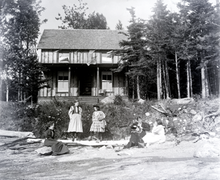 Group of girls in front of Foster cottage, Shady Nook, Trenton, Maine.