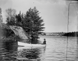 Delia Foster rowing and Frances Foster steering in my boat near point on west side of Union River